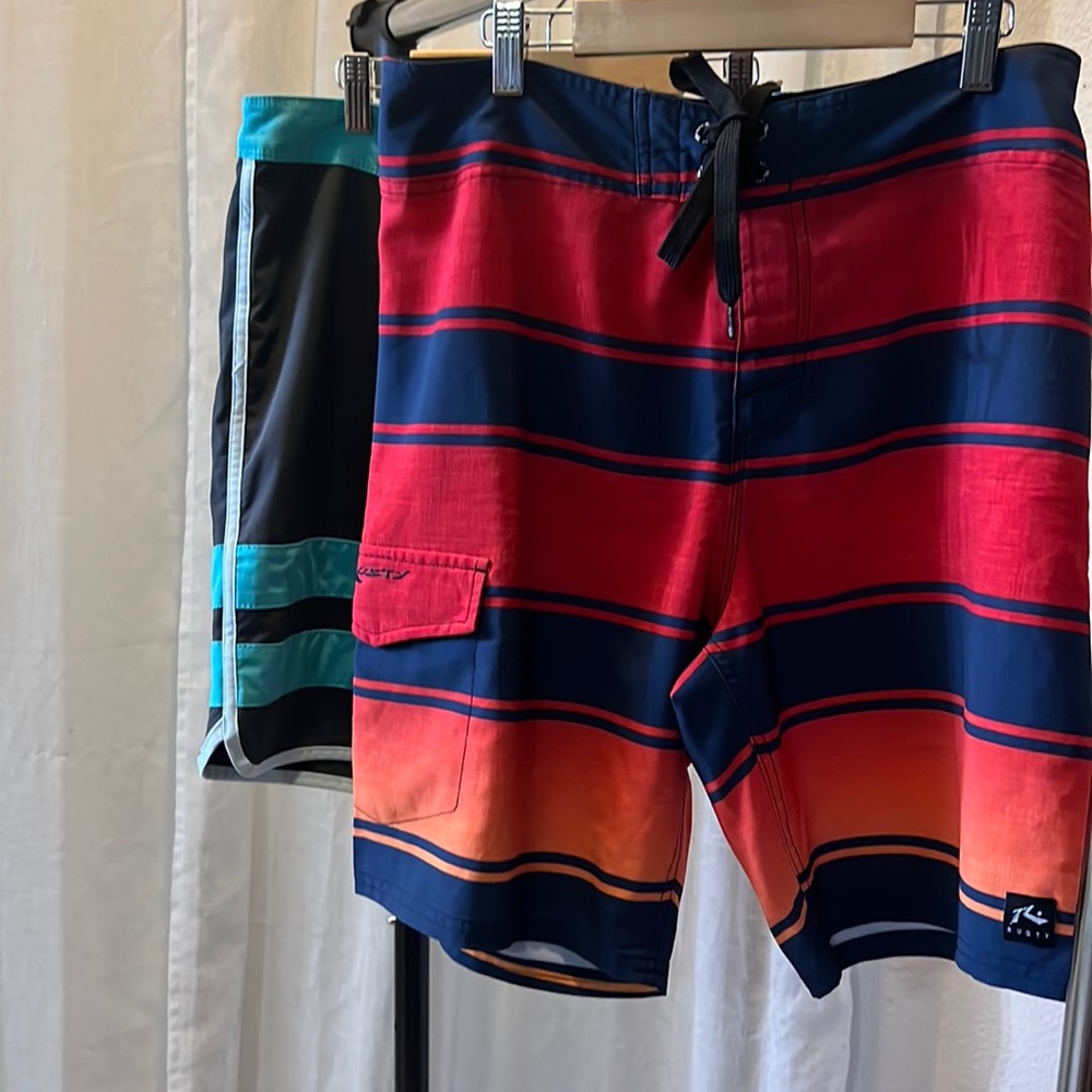 2 items: Hurley sky blue/gray swimming shirt, Rusty red/navy blue shorts